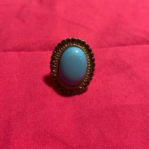 Light blue ring with dark gray rhinestones